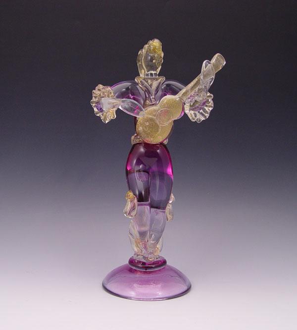 Appraisal: AVENTURINE VENETIAN ART GLASS FIGURE OF GUITAR PLAYER Hues of