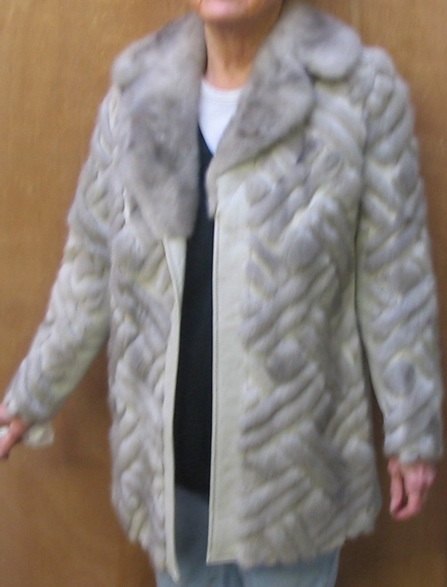 Appraisal: A LADY'S GRAY LEATHER COAT overlaid with mink fur in