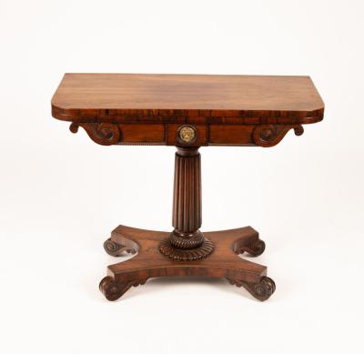 Appraisal: A Regency rosewood card table with scrolls to the frieze