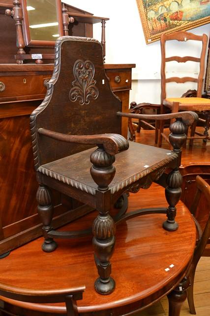 Appraisal: AN ENGLISH CARVED OAK ARMCHAIR AN ENGLISH CARVED OAK ARMCHAIR