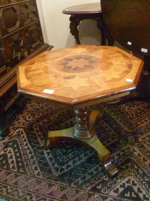 Appraisal: A VICTORIAN WALNUT OCCASIONAL TABLE with octagonal top turned pillar