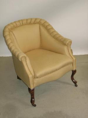 Appraisal: A VICTORIAN WALNUT FRAMED EASY CHAIR of tub form upholstered