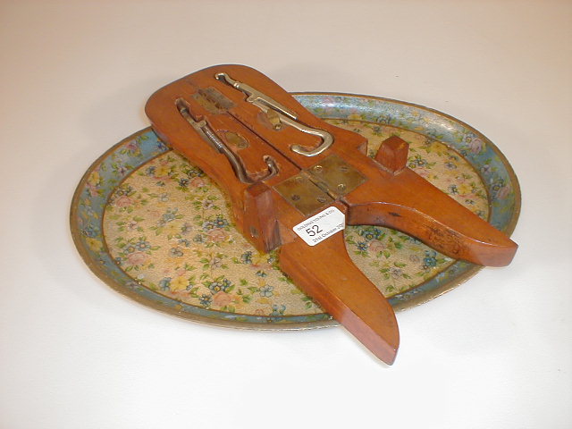 Appraisal: A gentleman's boot jack fitted with two steel boot pulls