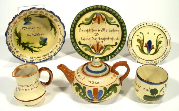 Appraisal: Six pieces of mottoware with inscribed script and painted decoration