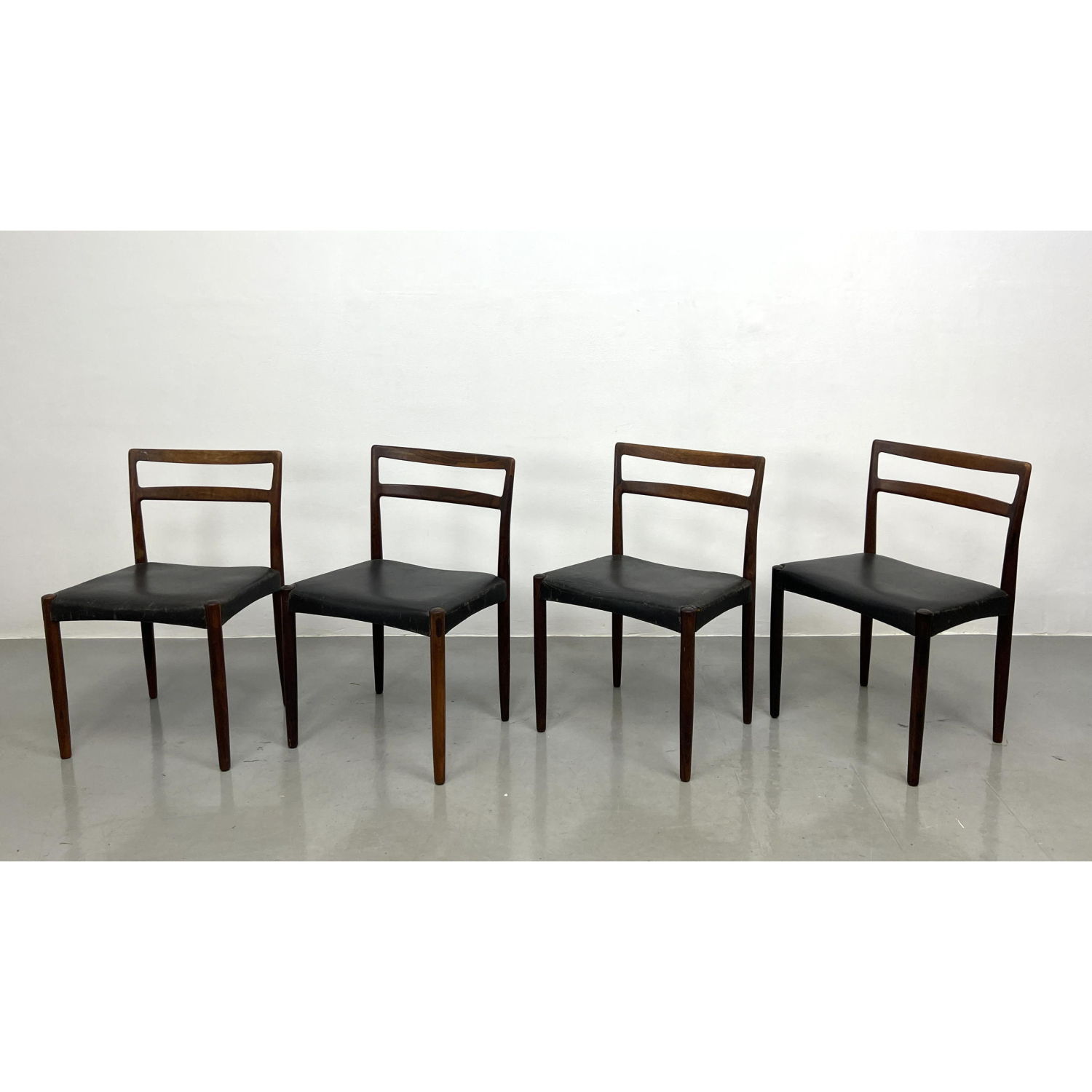 Appraisal: Danish Rosewood and Leather Side Dining Chairs ILLUMS BOLIGHUS Tag