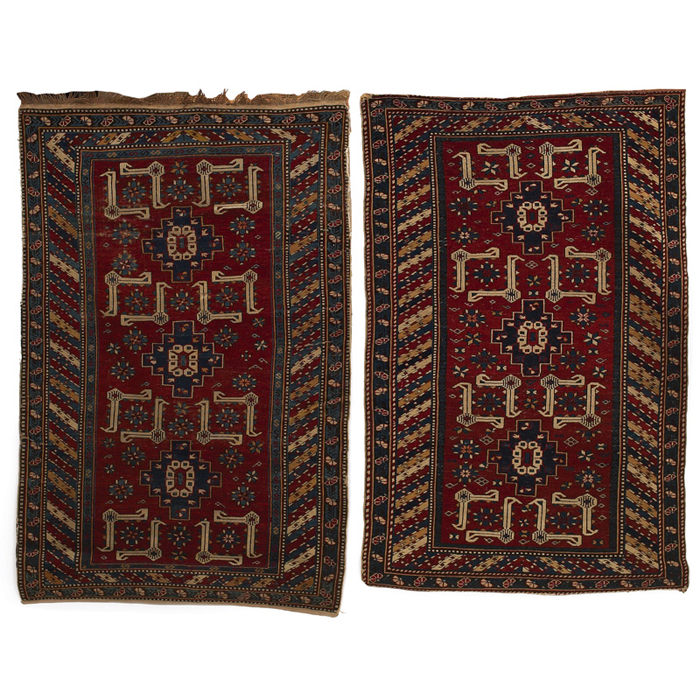 Appraisal: Caucasian Kuba rugs pair stylized floral design on a red