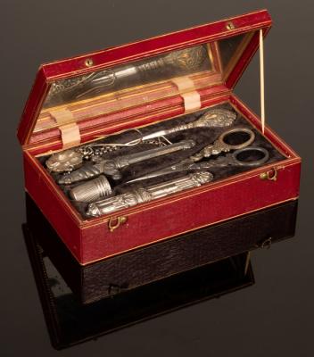 Appraisal: A sewing kit in a red leather case with gilt