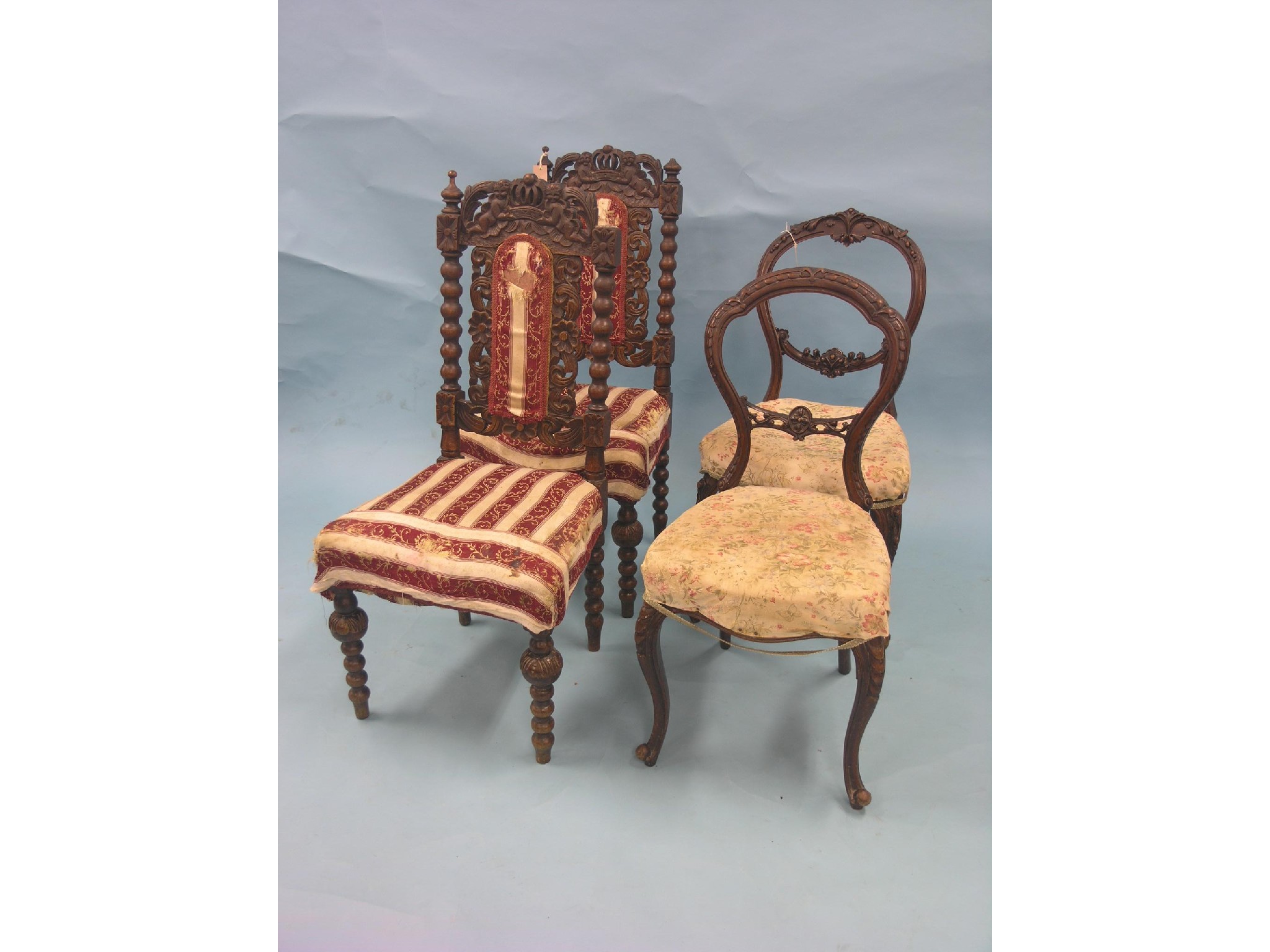 Appraisal: A pair of Victorian carved walnut balloon-back dining chairs and