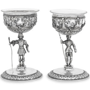 Appraisal: A Pair of German Silver Figural Goblets with Glass Liners