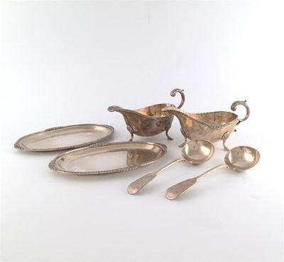 Appraisal: A pair of Indian silver sauce boats and stands marked