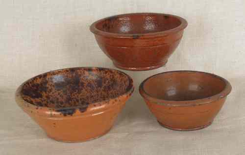 Appraisal: Three redware bowls th c with manganese decoration largest -