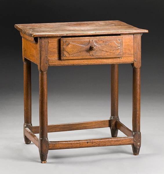 Appraisal: A French Provincial walnut tavern table early th century The