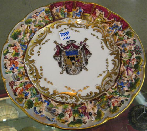 Appraisal: PAIR CAPODIMONTE PORCELAIN PLATES hand painted with coat of arms