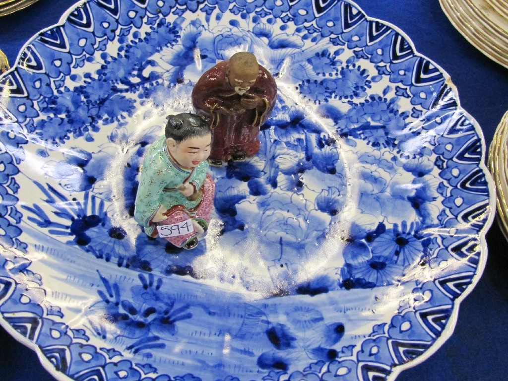 Appraisal: Oriental blue and white wall plate with two figures