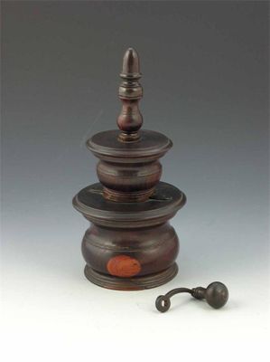 Appraisal: A George III turned lignum vitae coffee grinder with an