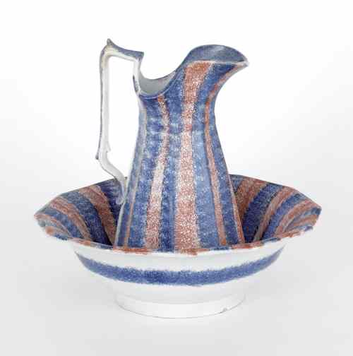 Appraisal: Blue and red rainbow spatter pitcher and bowl th c