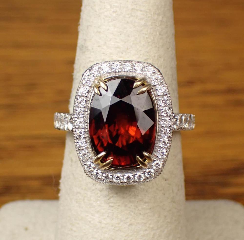 Appraisal: DIAMONDS AND RED ZIRCON RING k white gold single cushion-cut