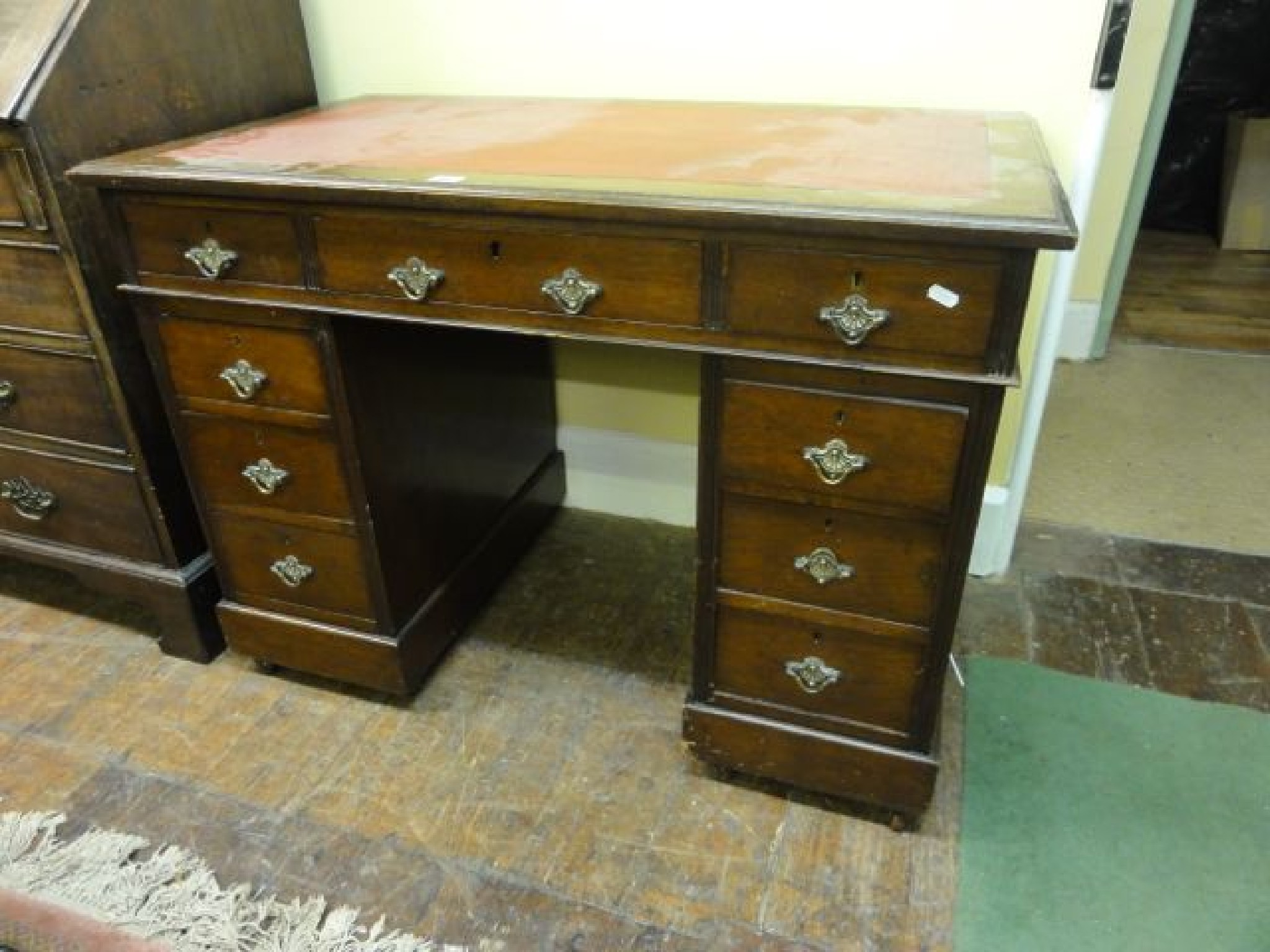 Appraisal: A small late Victorian walnut kneehole twin pedestal writing desk