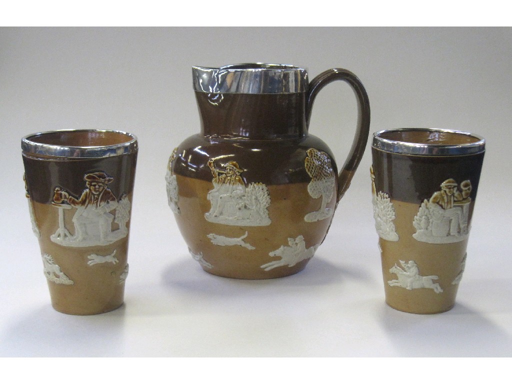 Appraisal: Doulton Lambeth stoneware salt glazed jug and two beakers each