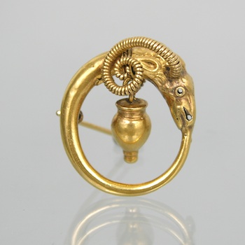 Appraisal: A Gold Ram Head Brooch Unmarked gold circular brooch modeled