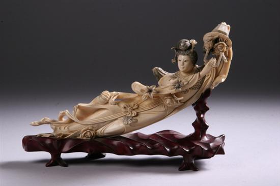 Appraisal: CHINESE IVORY FIGURE OF WOMAN Reclining holding a basket of