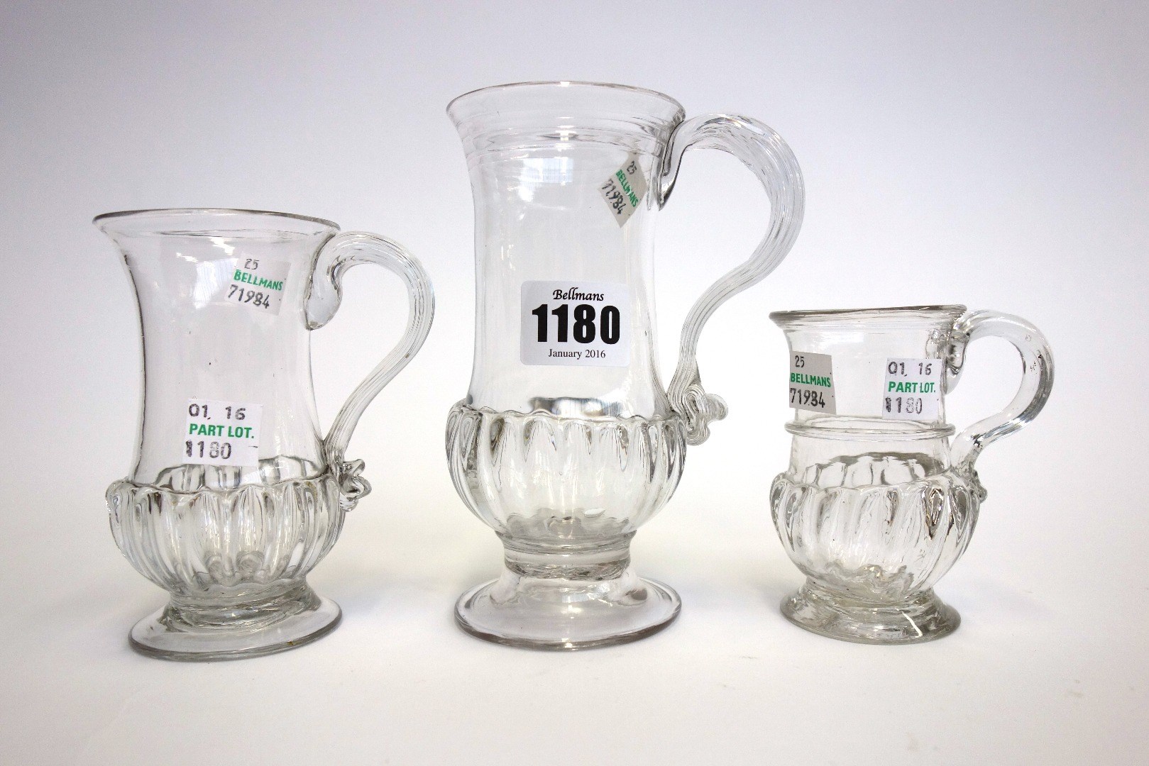 Appraisal: Three English glass mugs circa of similar gadrooned form the