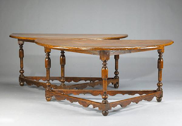 Appraisal: A pair of Northern Italian Baroque walnut demilune tables late