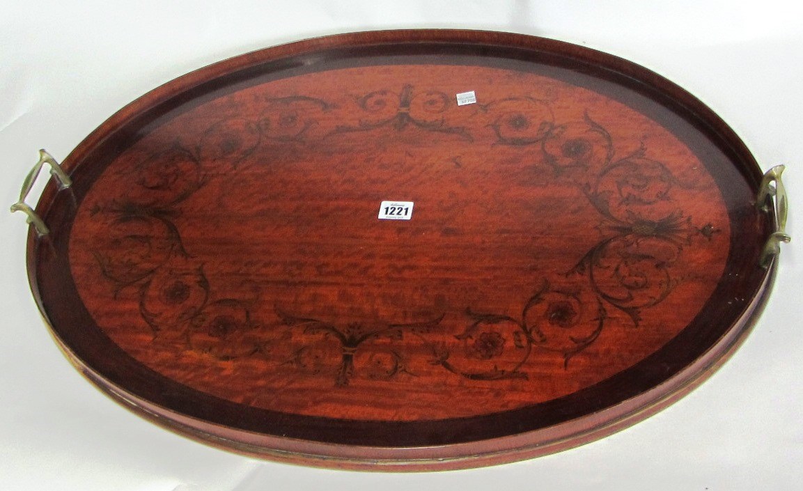 Appraisal: A late th century marquetry inlaid satinwood and mahogany oval