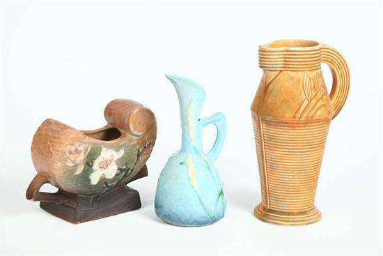 Appraisal: THREE PIECES OF ART POTTERY An apricot Roseville planter in