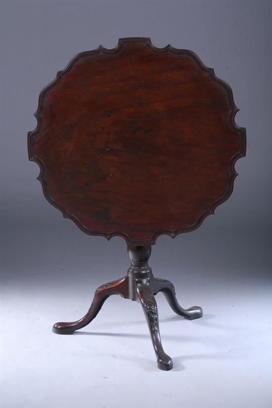 Appraisal: GEORGIAN STYLE MAHOGANY TILT-TOP TRI-POD TABLE early th century Serpentine