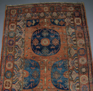 Appraisal: A Kurdish rug with blue medallions and trailing floral stems