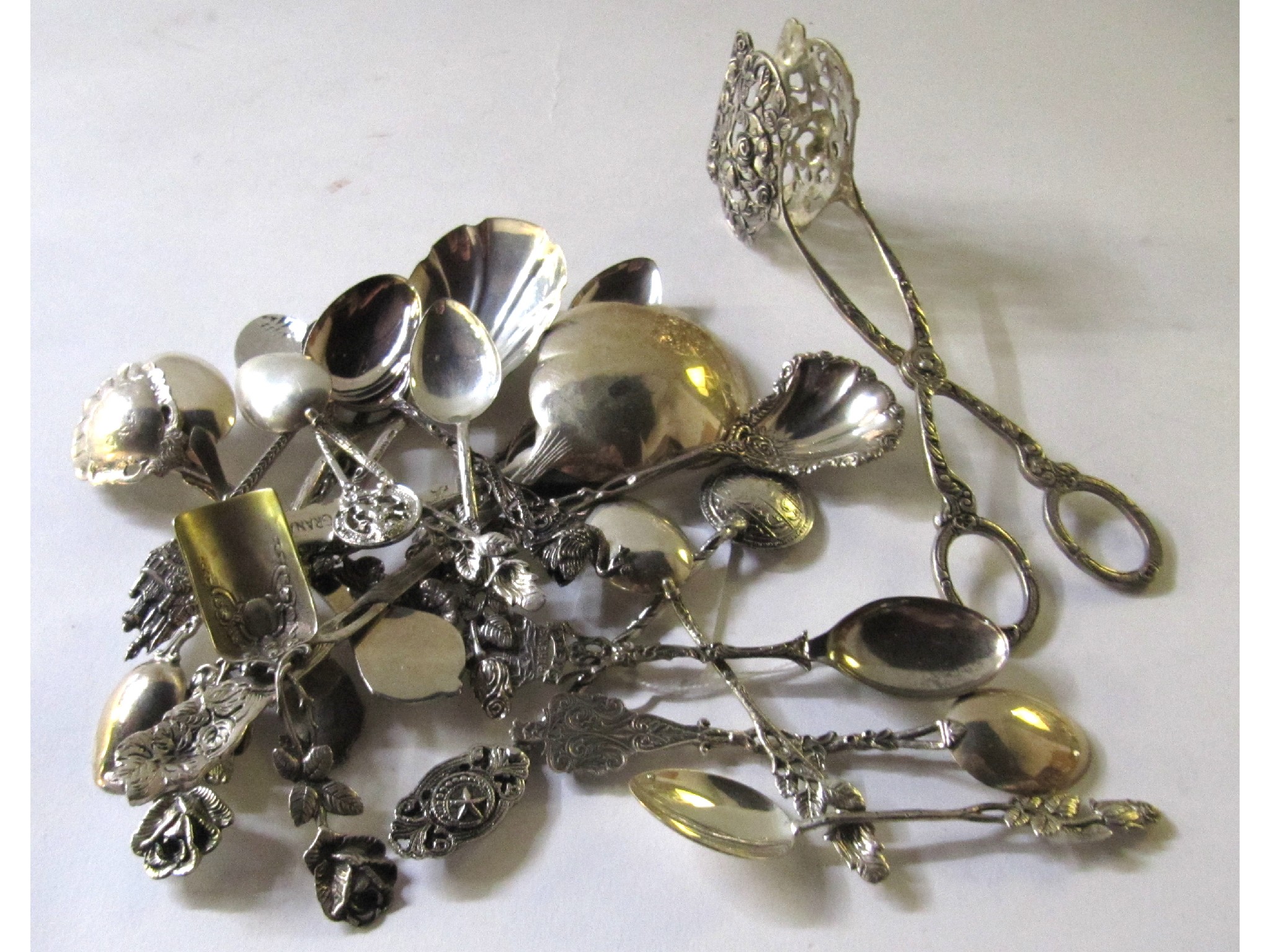 Appraisal: A lot comprising assorted continental silver spoons cake tongs etc