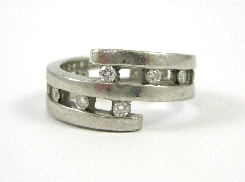 Appraisal: MAN'S DIAMOND AND PLATINUM RING channel set with round brilliant-cut