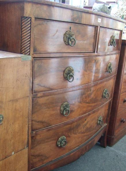 Appraisal: A George IV mahogany bowfront chest with two short over