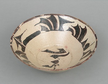 Appraisal: A Nishapur Calligraphy Bowl A pottery bowl with painted glaze