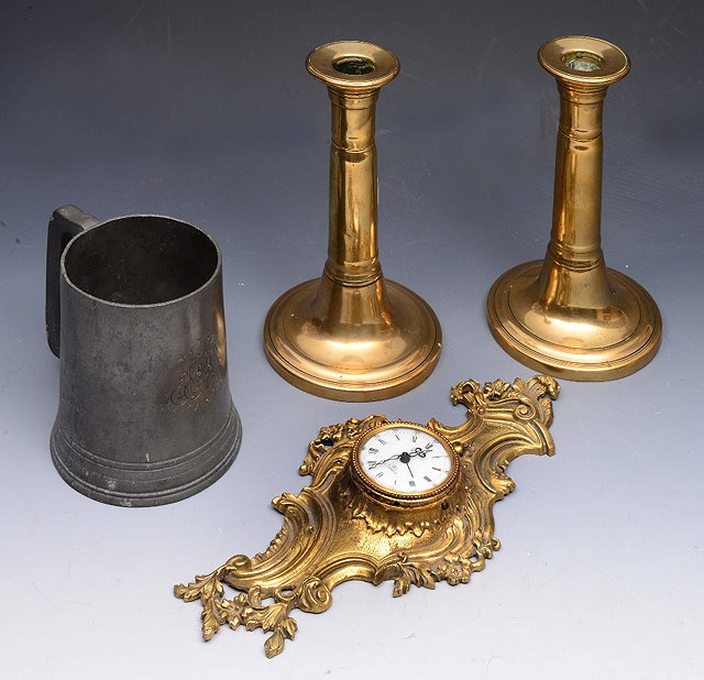 Appraisal: A PAIR OF VICTORIAN BRASS CANDLESTICKS of tapering form with