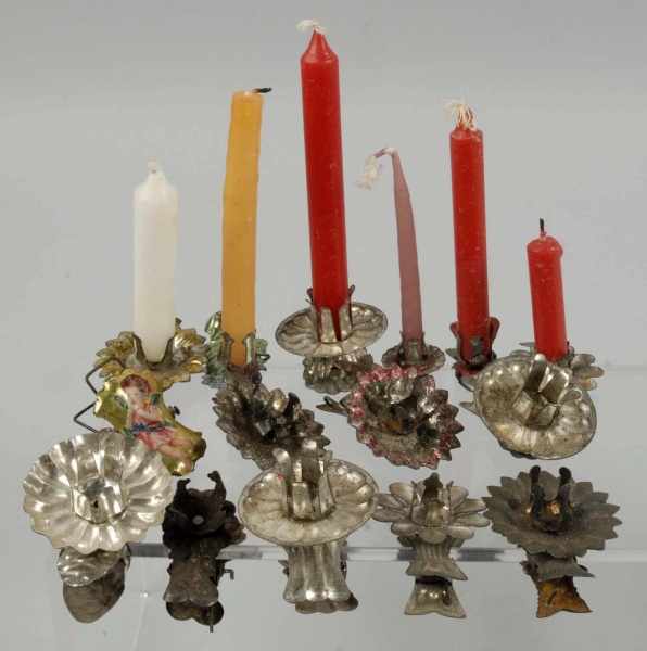 Appraisal: Large Lot of Candle Holder Clip-Ons Description Over assorted tin