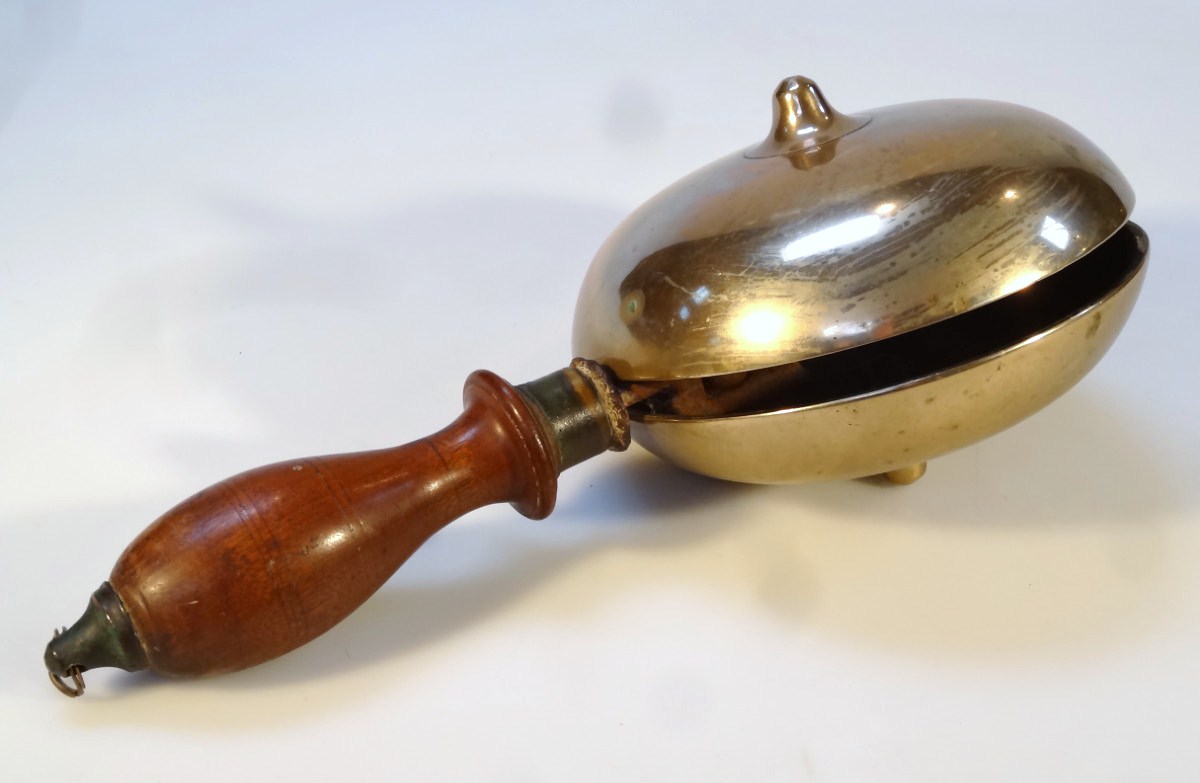 Appraisal: An early thC brass and mahogany hand bell the circular