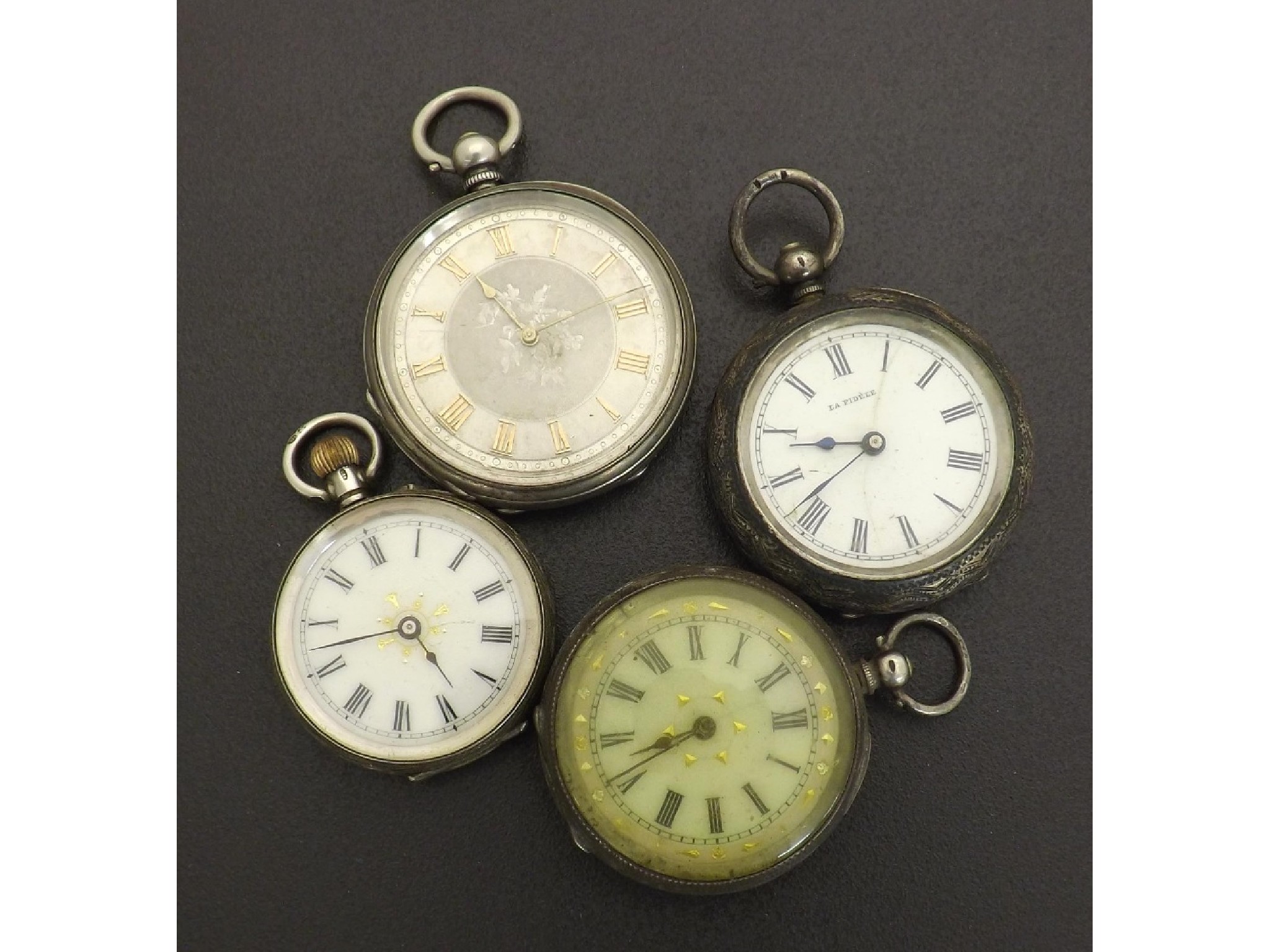 Appraisal: Four silver cylinder engraved fob watches