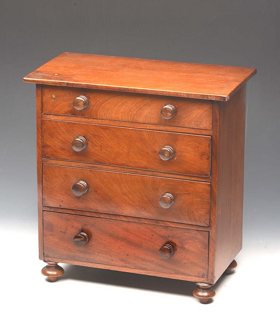 Appraisal: A VICTORIAN MAHOGANY APPRENTICE CHEST of four long drawers with