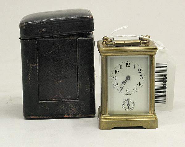 Appraisal: A small French gilt brass carriage clock in leather traveling