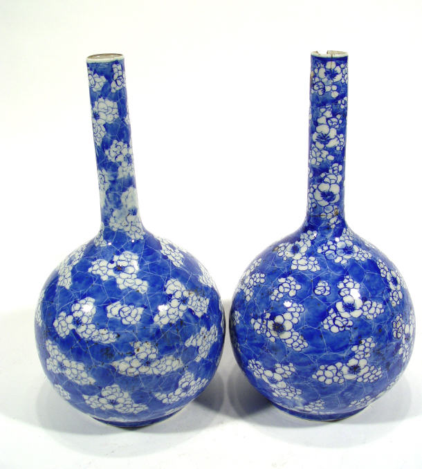 Appraisal: Pair of Chinese porcelain prunus bottle vases cm high