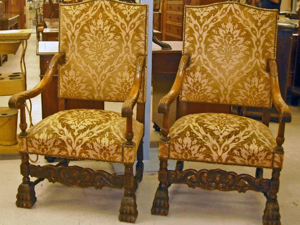 Appraisal: Pair of th century style upholstered carved hall armchairs with