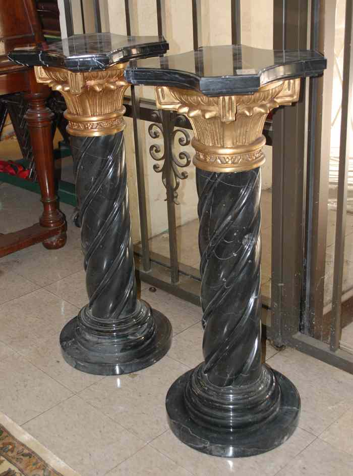 Appraisal: A PAIR OF ORMOLU AND BLACK PORFIDO MARBLE PEDESTALS each