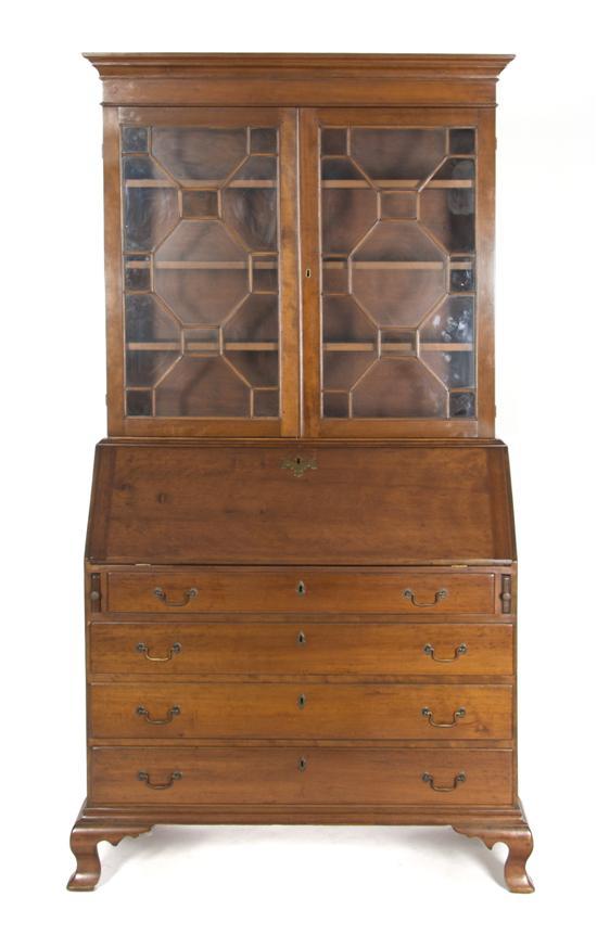 Appraisal: An American Secretary Bookcase having a molded cornice over two