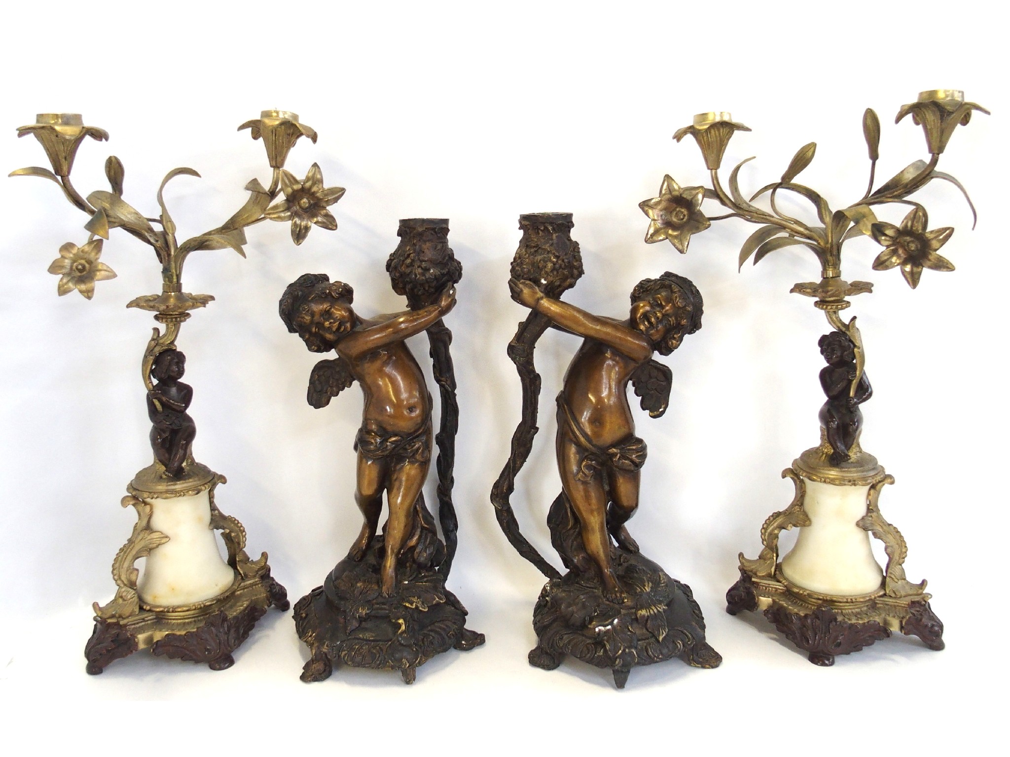 Appraisal: Two pairs of cherub decorated candlesticks