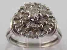 Appraisal: A white metal tests carat gold diamond cluster ring approx