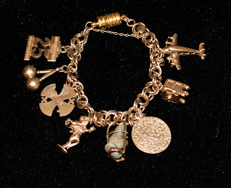 Appraisal: - Unmarked tested k gold charm bracelet with a gold-filled