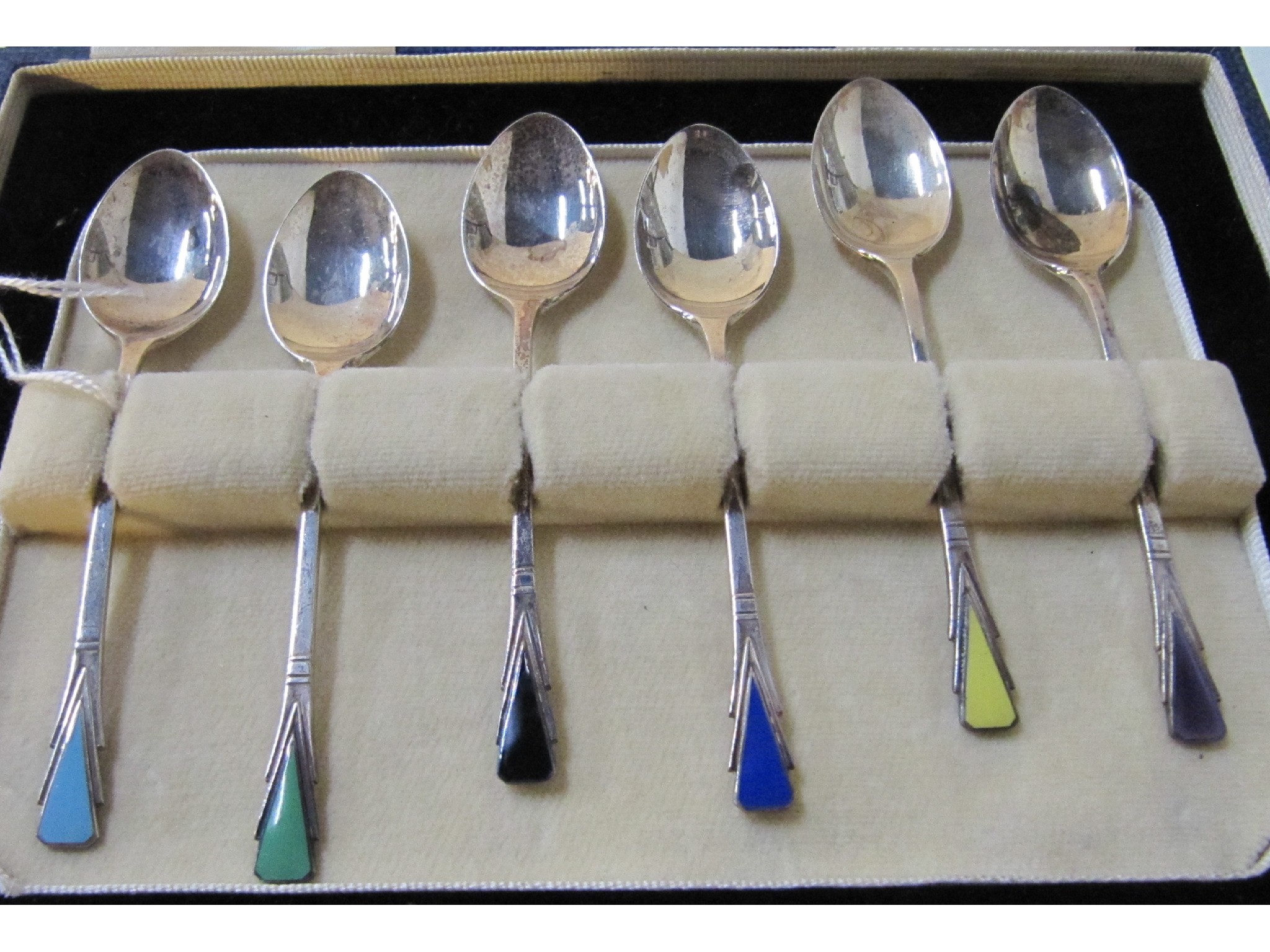 Appraisal: A cased set of six silver and enamel coffee spoons