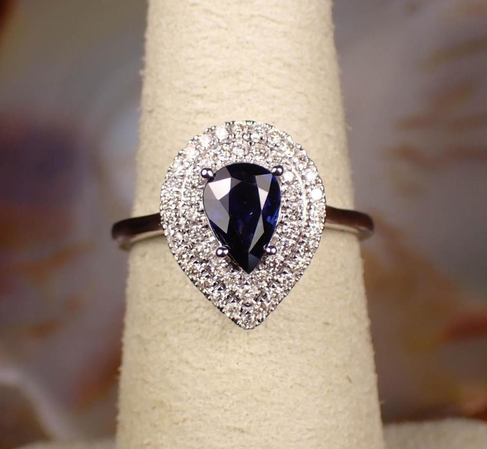 Appraisal: DIAMOND SAPPHIRE AND FOURTEEN KARAT GOLD RING having a single